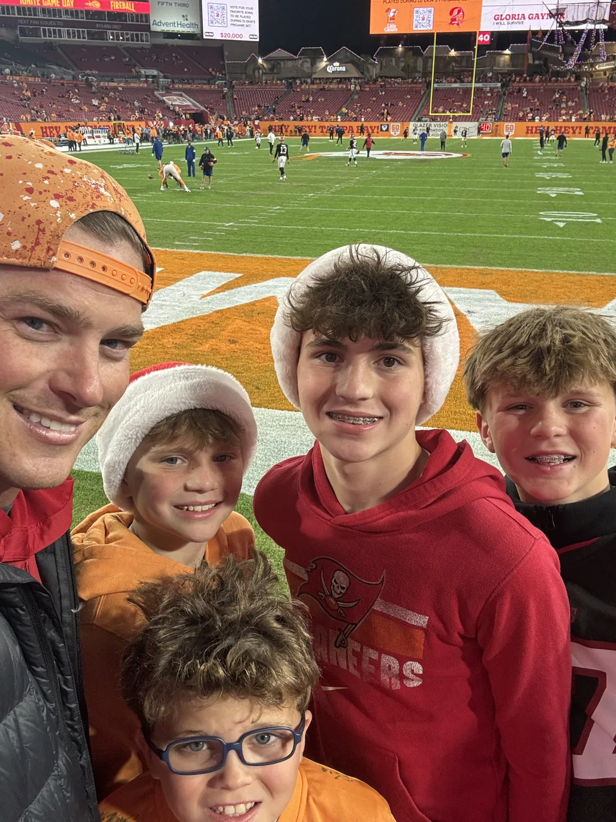John Plumstead and the four Plumstead boys at a Buccaneers game